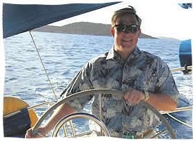 island groom at the helm