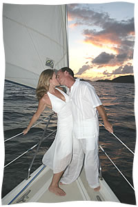 kiss on the bow sunset wedding