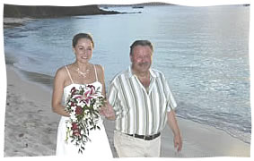 walking the bride down the beach at Honeynmoon