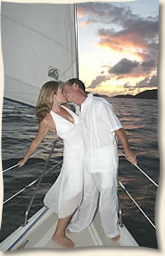 kiss on the bow sunset wedding